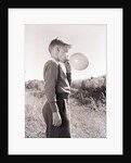 Boy Blowing a Balloon by Anonymous