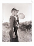 Boy Blowing a Balloon by Anonymous
