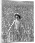 Girl Standing in Wheat Field by Anonymous