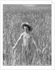 Girl Standing in Wheat Field by Anonymous