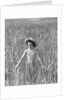 Girl Standing in Wheat Field by Anonymous
