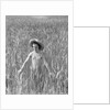 Girl Standing in Wheat Field by Anonymous