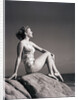 Young Woman in Swimsuit Seated on Rock by Anonymous
