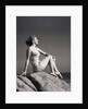 Young Woman in Swimsuit Seated on Rock by Anonymous