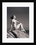 Young Woman in Swimsuit Seated on Rock by Anonymous