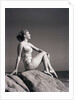 Young Woman in Swimsuit Seated on Rock by Anonymous