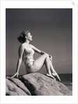 Young Woman in Swimsuit Seated on Rock by Anonymous