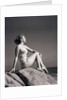 Young Woman in Swimsuit Seated on Rock by Anonymous