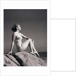 Young Woman in Swimsuit Seated on Rock by Anonymous