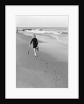 Woman Walking on Beach Leaving Footprints by Anonymous