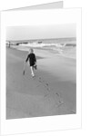 Woman Walking on Beach Leaving Footprints by Anonymous
