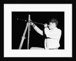 Boy Looking Through a Telescope by Anonymous