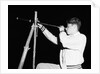 Boy Looking Through a Telescope by Anonymous