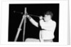 Boy Looking Through a Telescope by Anonymous