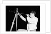 Boy Looking Through a Telescope by Anonymous