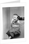 Monkey in Clothing Holds Phone Receiver by Anonymous