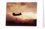 Chinook Helicopter Lifts Ammunition by Anonymous