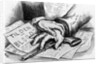 Two hands that are touching a gun that is laying on advertisments by Anonymous