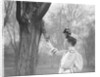 Woman Feeding a Squirrel by Anonymous