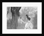 Woman Feeding a Squirrel by Anonymous