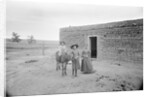 Women and Child Outside Ranch House by Anonymous