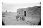 Women and Child Outside Ranch House by Anonymous