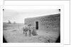 Women and Child Outside Ranch House by Anonymous