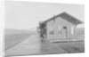Man Waiting at Railroad Station by Anonymous