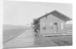 Man Waiting at Railroad Station by Anonymous