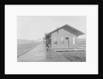 Man Waiting at Railroad Station by Anonymous