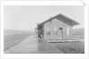 Man Waiting at Railroad Station by Anonymous