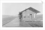 Man Waiting at Railroad Station by Anonymous