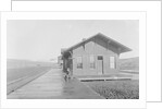 Man Waiting at Railroad Station by Anonymous