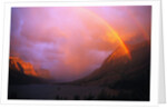 Rainbow and Clouds over a Valley by Anonymous