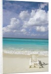Lone Lounge Chair on Sandy Beach by Anonymous