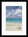 Lone Lounge Chair on Sandy Beach by Anonymous