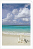 Lone Lounge Chair on Sandy Beach by Anonymous