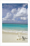 Lone Lounge Chair on Sandy Beach by Anonymous