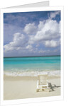 Lone Lounge Chair on Sandy Beach by Anonymous