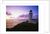 Lighthouse by Beach at Sunset by Anonymous
