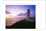 Lighthouse by Beach at Sunset by Anonymous