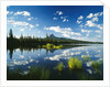 Clouds in Sky Reflected by Mountain Lake by Anonymous