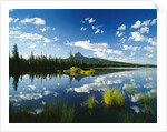 Clouds in Sky Reflected by Mountain Lake by Anonymous