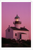Lighthouse Against a Pink Sky at Twilight by Anonymous