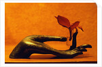 Sculpted Hand Holding Massage Oil Vial by Anonymous