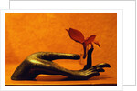Sculpted Hand Holding Massage Oil Vial by Anonymous