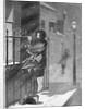 Women Peering Inside Window by Anonymous
