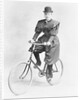 Suffragette Dressed in Man's Hat on Bicycle by Anonymous