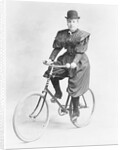 Suffragette Dressed in Man's Hat on Bicycle by Anonymous