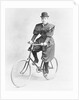 Suffragette Dressed in Man's Hat on Bicycle by Anonymous
